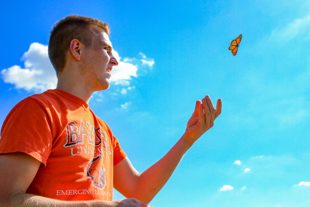 ecology student tagging butterfly