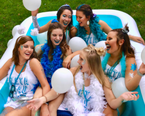 Photo of Zeta Tau Alpha women in a pool with balloons laughing