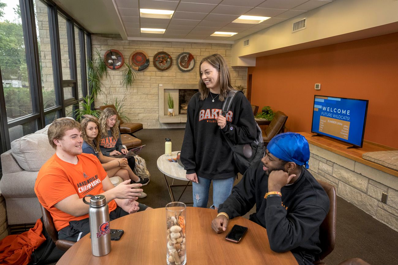 Students chatting in the lobby of the visitors center.