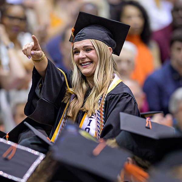Kaycee Tanner om cap, gown, cords, and stole at Commencement Ceremony
