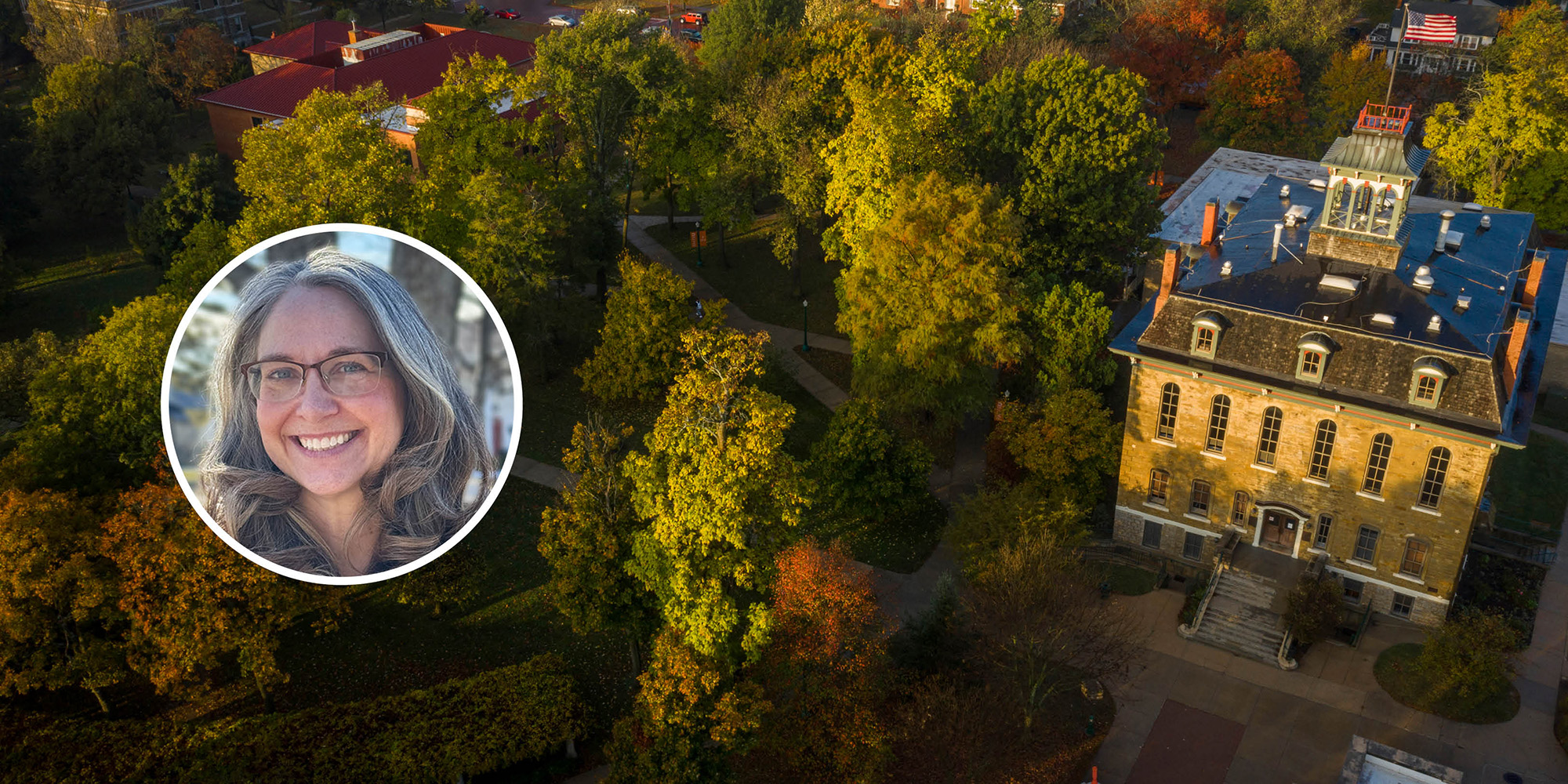 head shot of cassy bailey on top of a drone photo of campus in the fall
